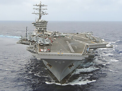 Aircraft carrier USS Nimitz (CVN 68) gracefully transits the vast expanse of the Pacific Ocean