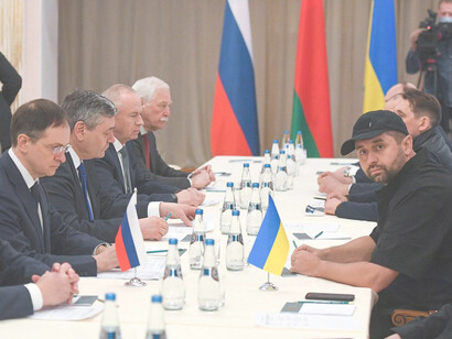 Vladimir Medinsky, (second left) head of the Russian delegation, and Davyd Arakhamia, (third right) faction leader of the Servant of the People party in the Ukrainian Parliament, attend peace talks in Gomel region, Belarus, Monday, February 28, 2022