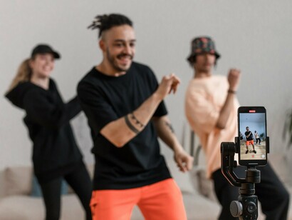 A group of dancers performing for a camera, representing the spontaneous, homemade spirit of early YouTube