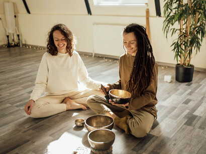 The practitioners use their hands to channel healing energy, reflecting the connection between Reiki’s spiritual approach and the modern scientific study of bio-electromagnetic activity