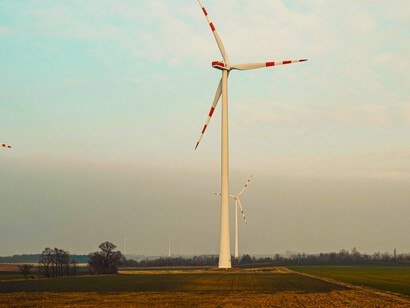 A scenic rural landscape featuring wind turbines producing renewable energy, Uithuizermeeden, Groningen, Netherlands