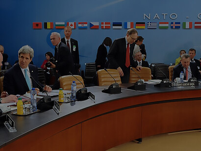 John Kerry and William Hague engage in NATO-Ukraine Commission Session at Brussels HQ, April 1, 2014
