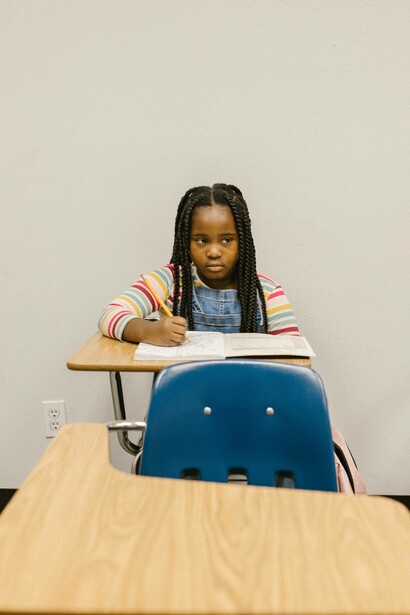 Young girl writes and experiences isolation