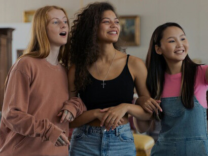 Friends shopping together at an antique store, exploring second-hand options and supporting sustainable fashion through charity shops