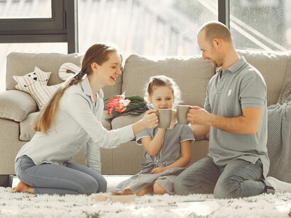 Happy family enjoying time together in their living room at home