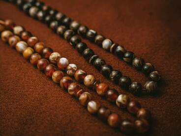 A set of prayer beads, symbolising continuity of belief and culture even as the world moves forward