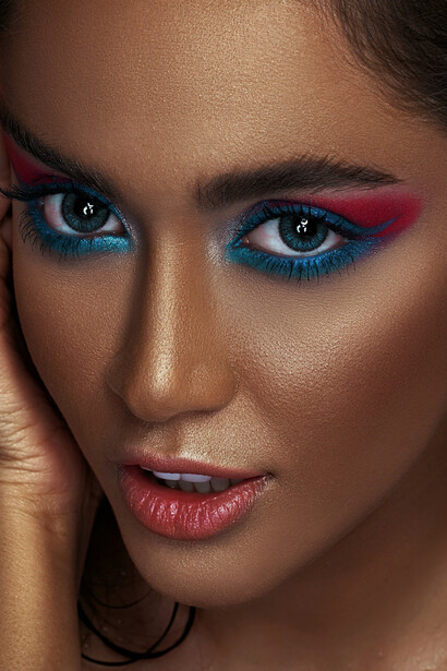 A woman with one blue eye and one brown eye makeup