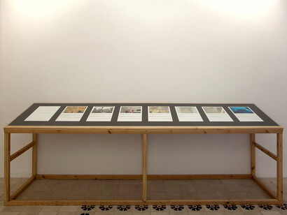Instructions to Create Your Personal Dubai at Home, 2013, Impressão a jacto de tinta sobre papel de algodão | Inkjet print on cotton paper, 60 x 45 cm (cada/each) / 120 x 400 x 80 cm (mesa/table)
