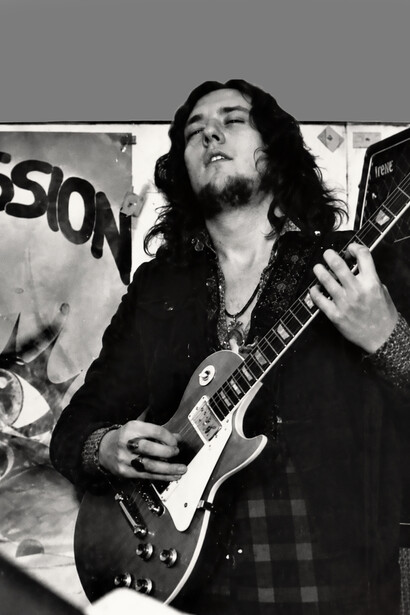 Marcello Capra on stage, captured during an energetic live concert performance