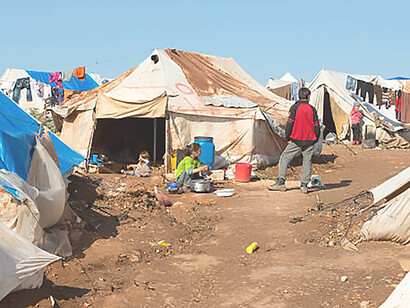 Syrian children in crowded refugee camp