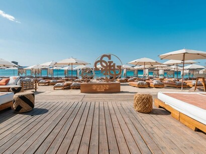 Guess Beach Club in Mykonos, Greece, offering Aegean chic and bohemian luxury