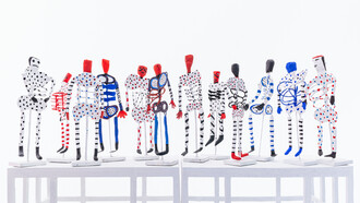 Paper skeleton sculptures on metal stands for the exhibition of Mirades de Murjeres 