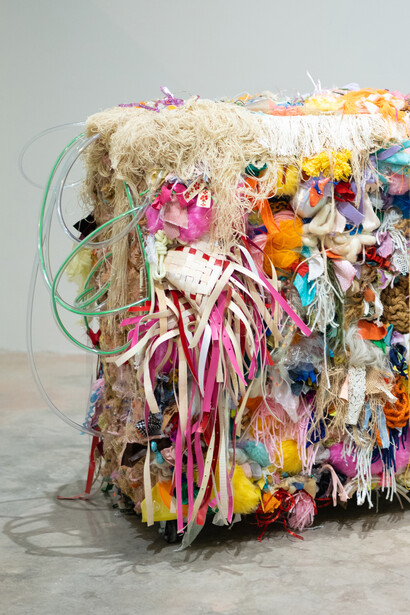 Mariel Miranda, Four wheels to handle something fragile (detail), 2023. Shipping wood crate, fabric, plastics, string, faux-leather belts, woven textiles, synthetic grass, life preserver, teddy bears, balloons, iridescent vinyl, pulp fibers, paper, grommet, casters. 59 x 30 x 24 inches / 149.9 x 76.2 x 61 cm. Courtesy of the artist and Track 16 Gallery