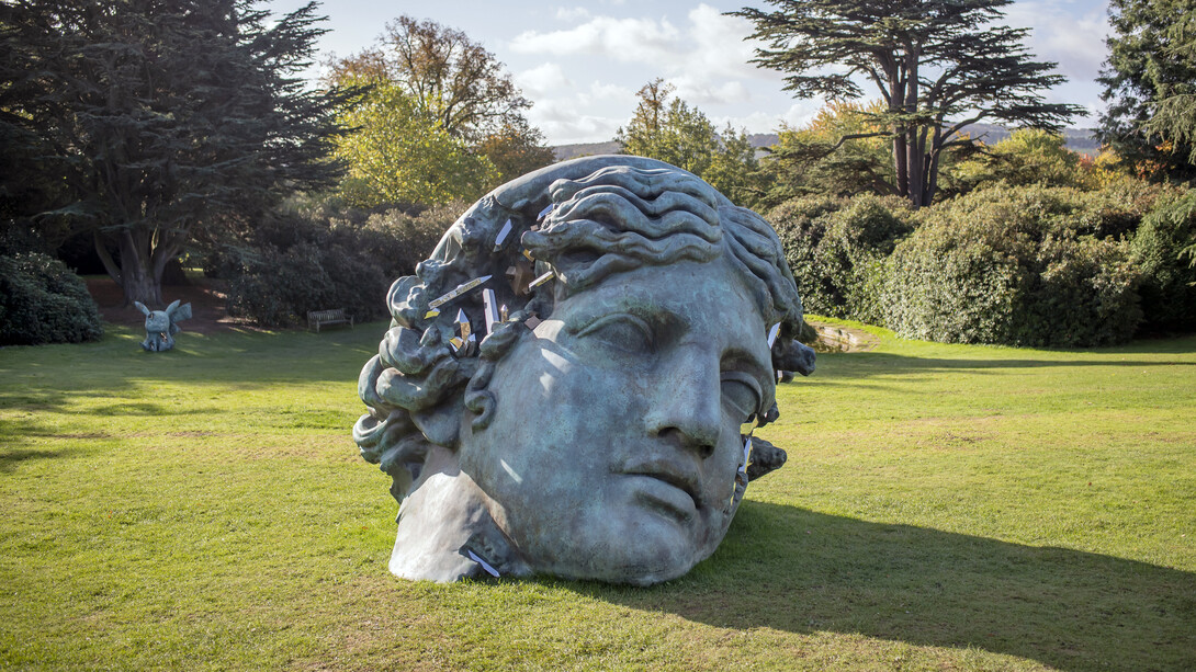 Daniel Arsham, Unearthed bronze eroded Melpomene, 2021. Installation view at Yorkshire Sculpture Park. Courtesy of Yorkshire Sculpture Park, Perrotin Gallery and Arsham Studio. Photo by Anthony Devlin/Getty Images