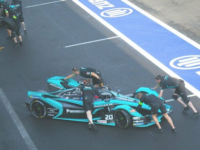 Men preparing for a car race