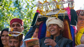 A group of people in traditional Himachali attire gathered in a circle, Kullu Valley, Himachal Pradesh, India