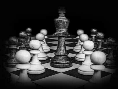 Chessboard in the dark represents the lack of connection education shares with the universal essence