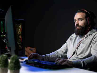 Gamer streaming a high-stakes online video game tournament