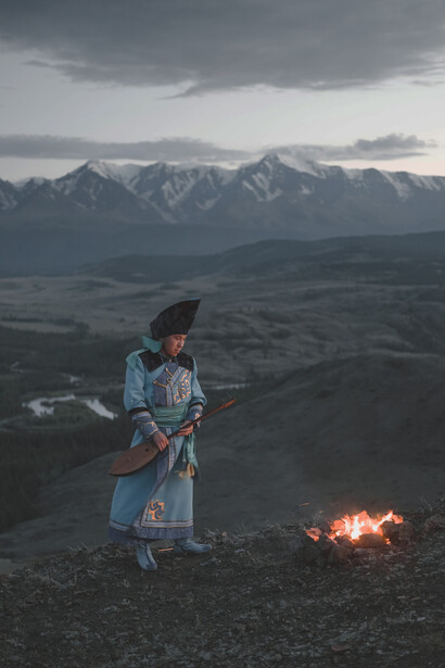 A native woman against the backdrop of Kailash 