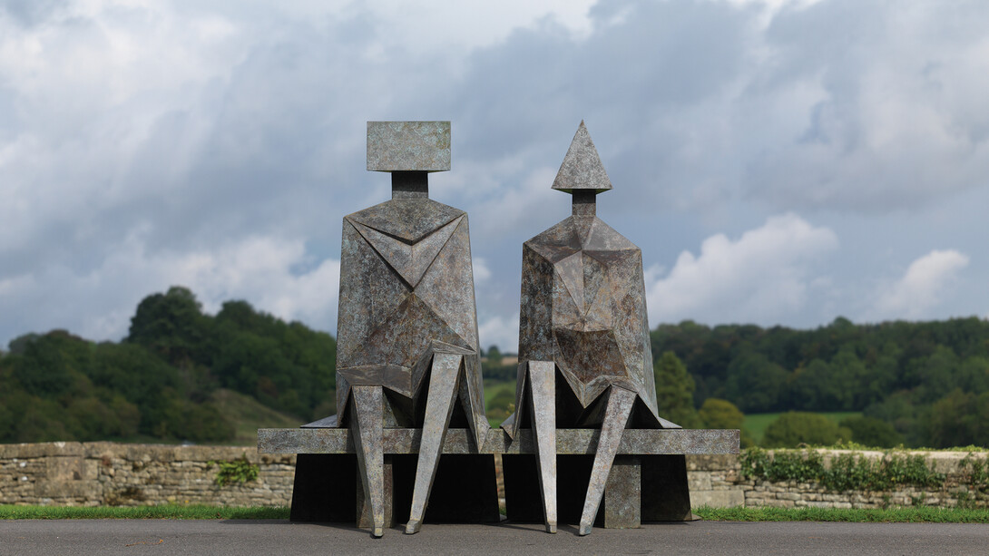 Lynn Chadwick, Sitting Couple on a Bench (front), 1990, Bronze, Edition 2 of 9, 194 x 211 x 183 cm, Courtesy of Pangolin London