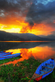 Golden sunset reflecting over Phewa Lake in Pokhara, Nepal