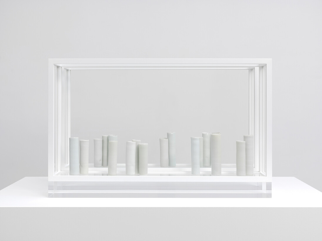 Edmund de Waal, And Speech, 2013, 18 porcelain vessels unglazed and glazed in celadons, in a pair of aluminium and plexiglass vitrines © the artist
