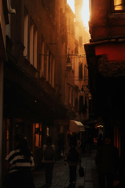 An old Cairo street at sunset, its dimly lit alleys glowing with nostalgic charm, Egypt