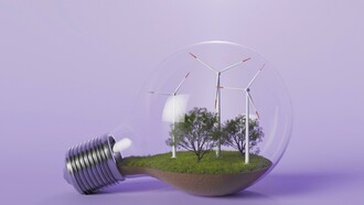 A conceptual lightbulb encloses wind turbines and trees, illustrating how innovation and renewable energy power a greener economic future
