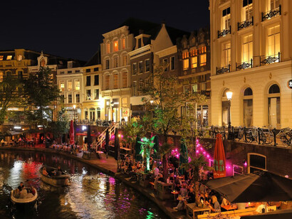 A river flows through Utrecht, weaving between tall buildings and picturesque canals Netherlands
