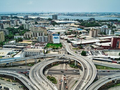 Abidjan’s dense urban landscape and extensive roadways, symbolising the aspirations of a rapidly developing African economy
