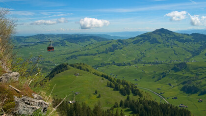 A car of the Luftseilbahn Wasserauen-Ebenalp in front of the landscape around Appenzell, Switzerland