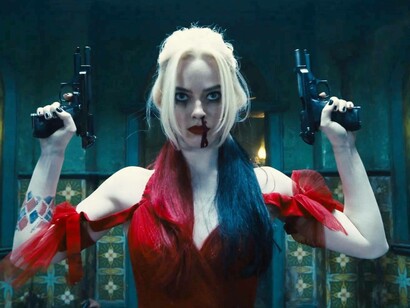 Harley Quinn played by Margot Robbie looks mad clutching double pistols