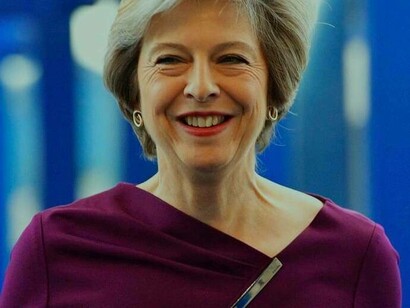 A delighted Theresa May excited about what she's about to potentially accomplish