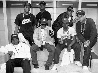 Ice Cube, Eazy-E, MC Ren. DJ Yella (front), and Dr. Dre, rapper Laylaw from Above The Law and rapper The D.O.C. (rear) poses for photos before their performances during N.W.A.'s 'Straight Outta Compton' tour at Kemper Arena in Kansas City, Missouri in June 1989