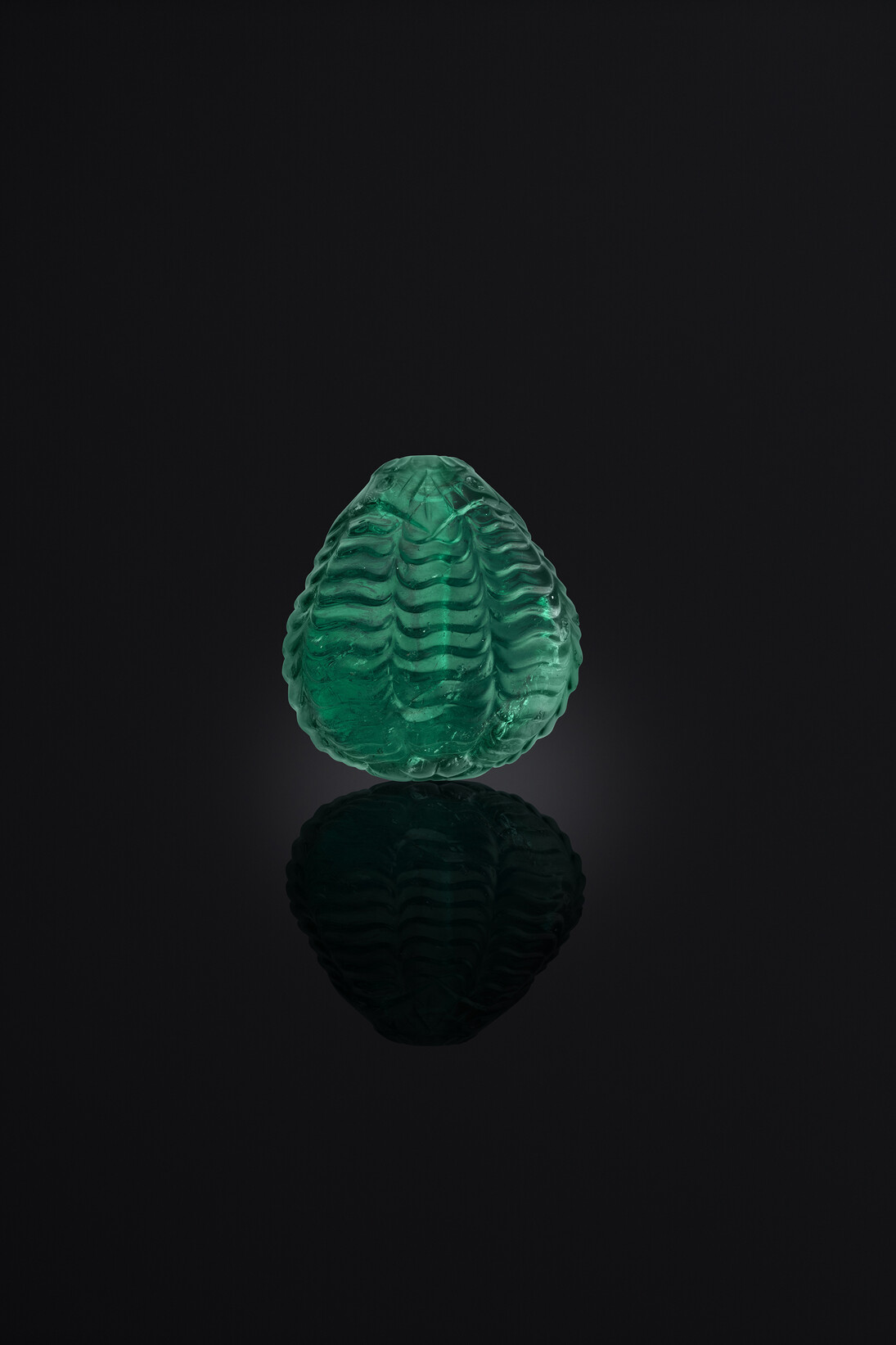 Carved emerald bead, Probably 18th century, Mughal Empire, The Al Thani Collection © Servette Overseas Limited, 2014. Photograph: Prudence Cuming Associates Ltd