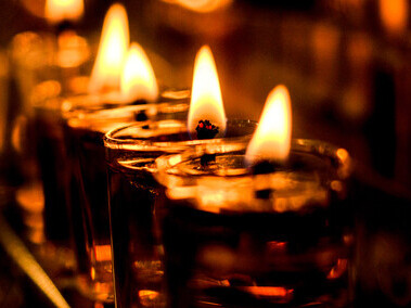 Warm candlelight with flickering flames, guiding the path ahead