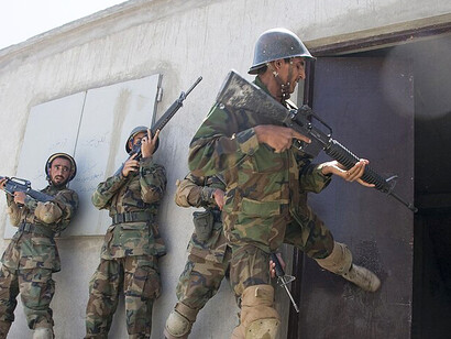 Afghan soldiers undergo urban operations training as part of their eight-week basic warrior course at the Kabul Military Training Center