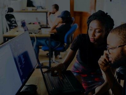 Two employees at a startup are figuring out the next moves in an attempt to participate in the workspace unity