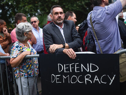 Paul Mason, the author of How to Stop Fascism, defends democracy at a protest