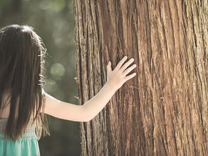 A child exploring nature's wonders, echoing Rousseau's educational ideals