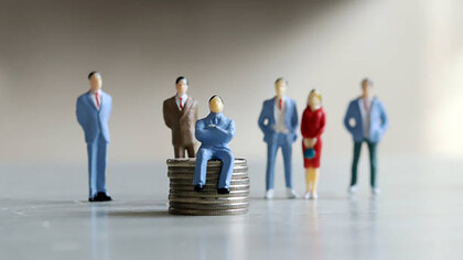 A man sits confidently atop a mound of coins, symbolizing his leadership, while a group of people stand behind him, portraying his influential role in matters of money and guidance