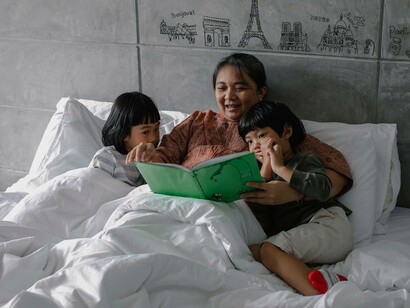 Grandmother laughs with her children while sharing story