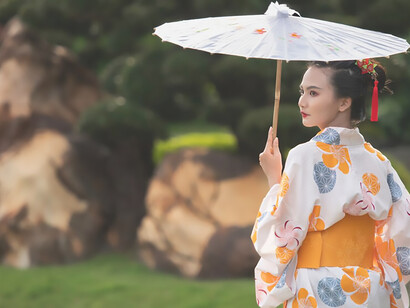 Allure of Japanese tradition as a kimono-clad woman gracefully holds a Wagasa umbrella, embodying the essence of cultural elegance