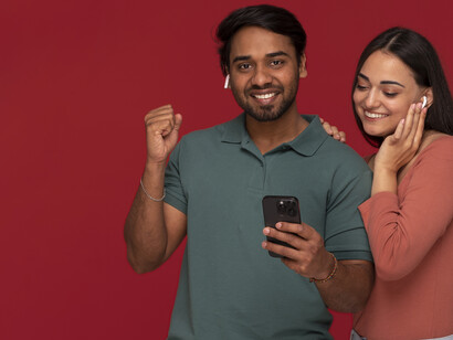 An Indian couple poses together, embodying the themes of cinematic storytelling, community, and the transformative power of change