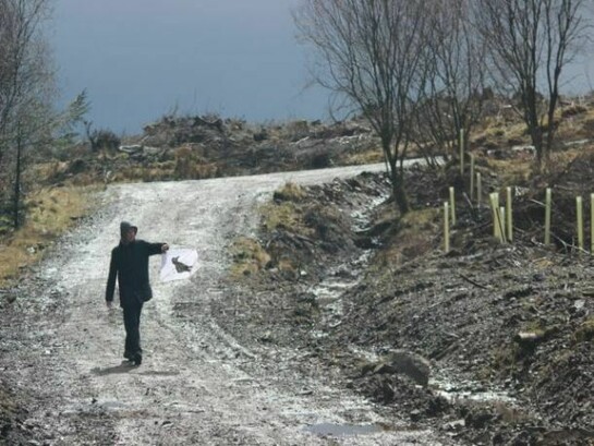 Photograph from The Nation//Live – Civil War
A participant with a banner at the site of Covenanters’ graves, Bad’s Knowe, Galloway,
© National Galleries of Scotland and Atlas Arts 2013