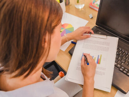 The student is deeply focused on data analysis as part of an active learning process at the university