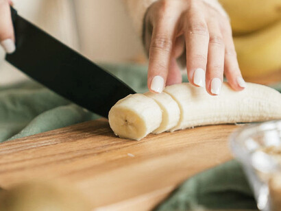 Bananas being prepared for Bariva, a dish that not only nourishes but also embodies the enduring traditions and communal values of Papua New Guinea's Rigo district
