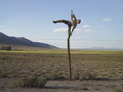 Lucas Foglia, Tommy Trying to Shoot Coyotes, Big Springs Ranch, Oasis, Nevada 2012, digital c-print on Fuji Crystal Archive paper mounted on Dibond. Courtesy of Robischon Gallery