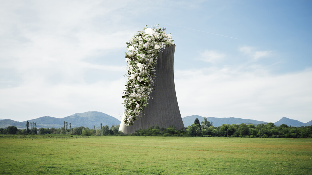 A nuclear reactor tower covered in white flowers