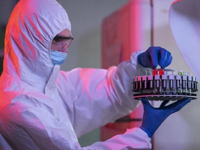 A researcher handling carefully prepared samples, representing the role of modern analytical science in evaluating human milk